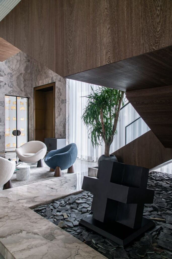 Stylish living space featuring contemporary furniture and marble textures.